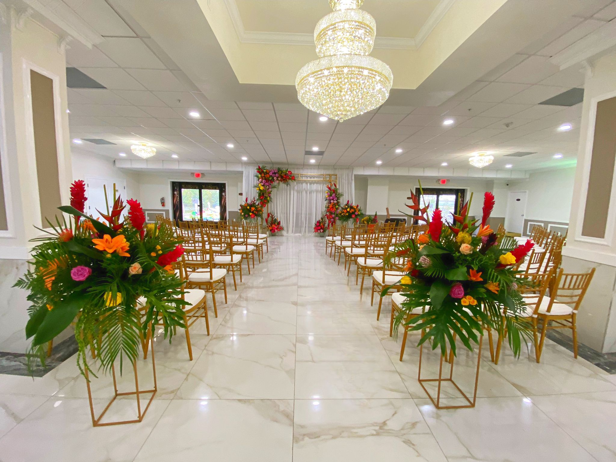Wide view of the main event hall with elegant table settings.